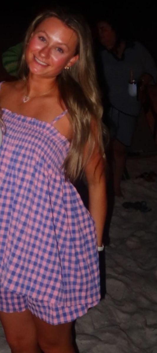 Client in a gingham set at the beach