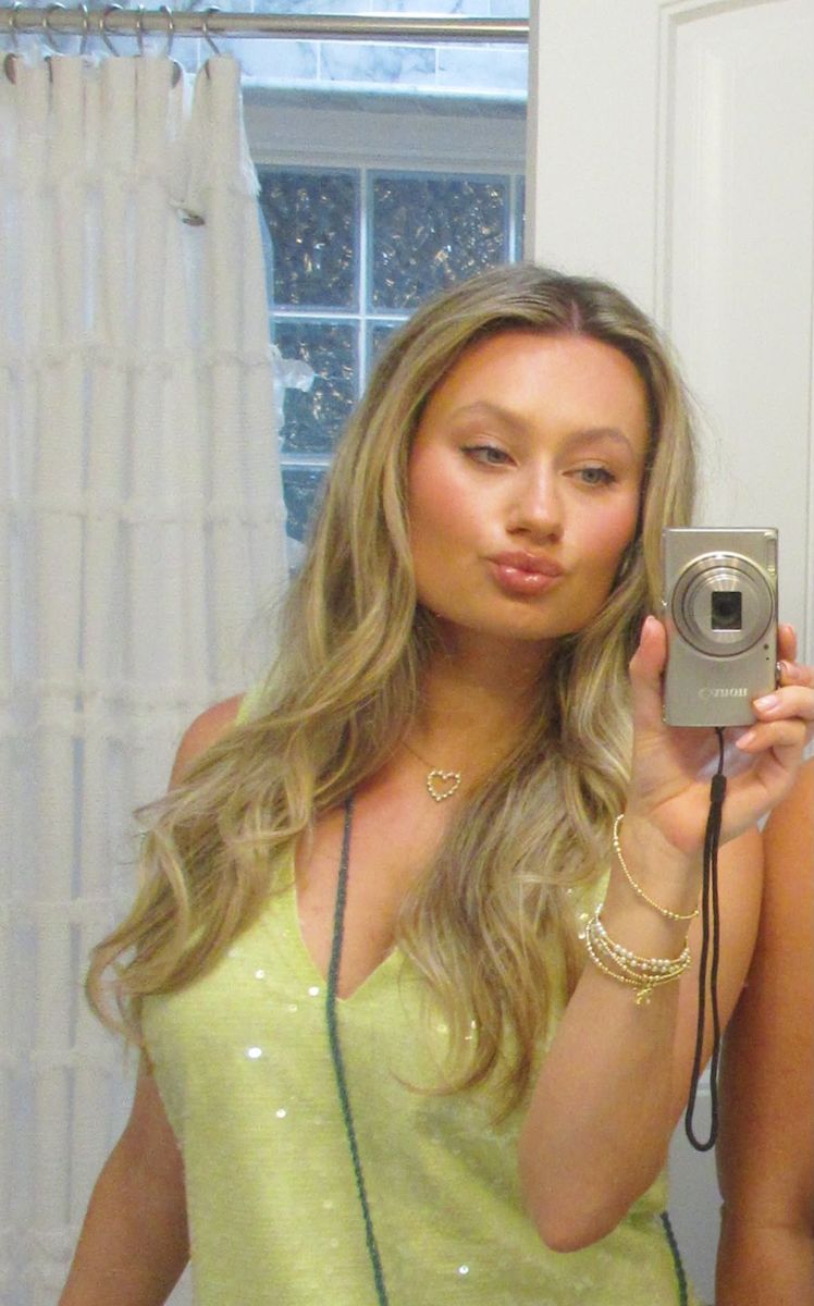 Client in a green sequin dress