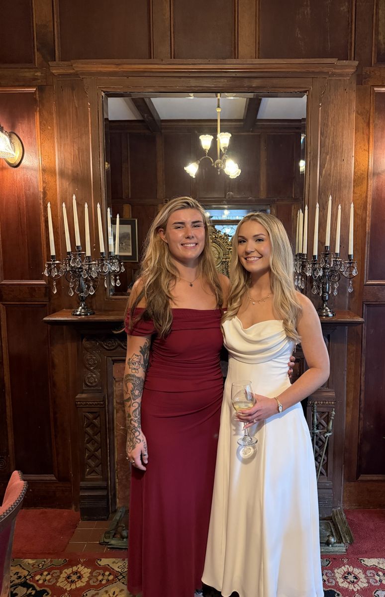 Two friends dressed for a wedding