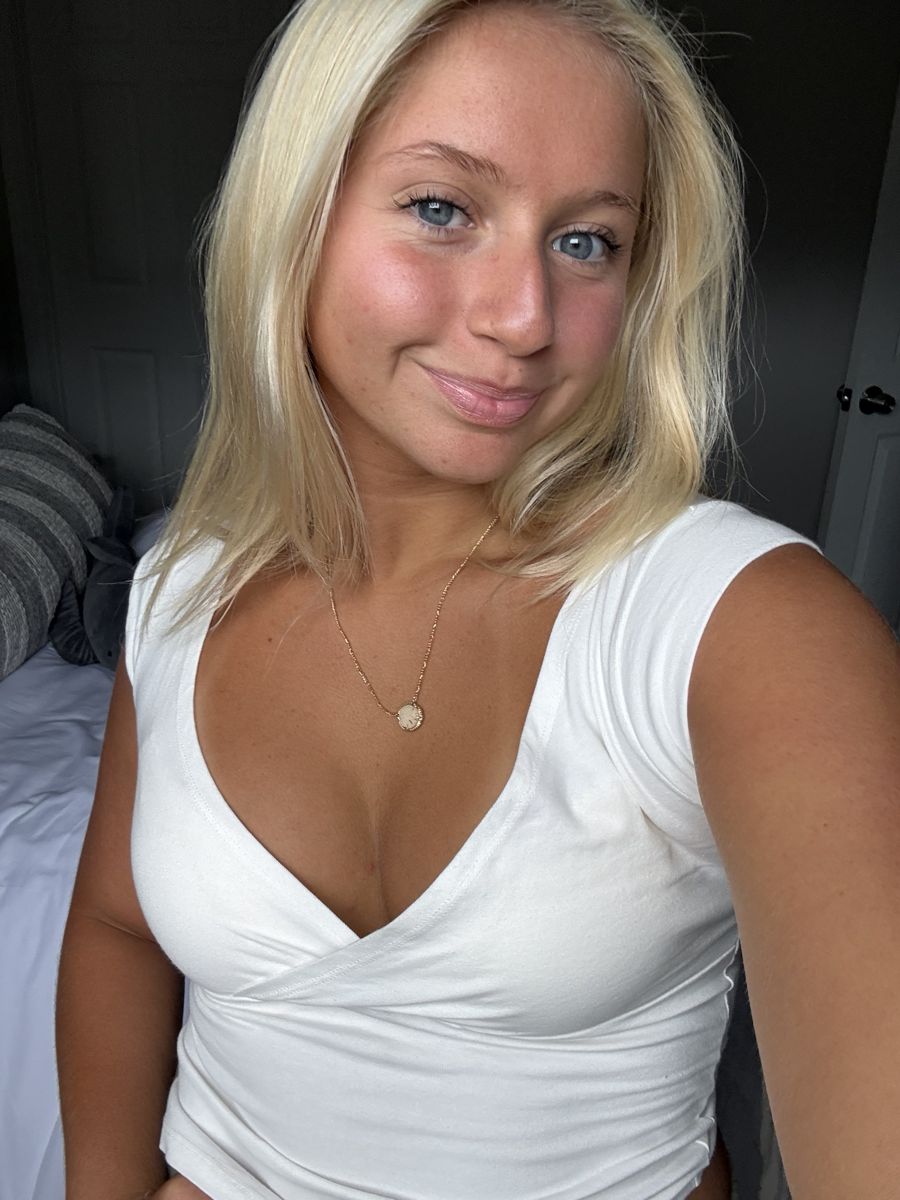 Client in a white top, glowing