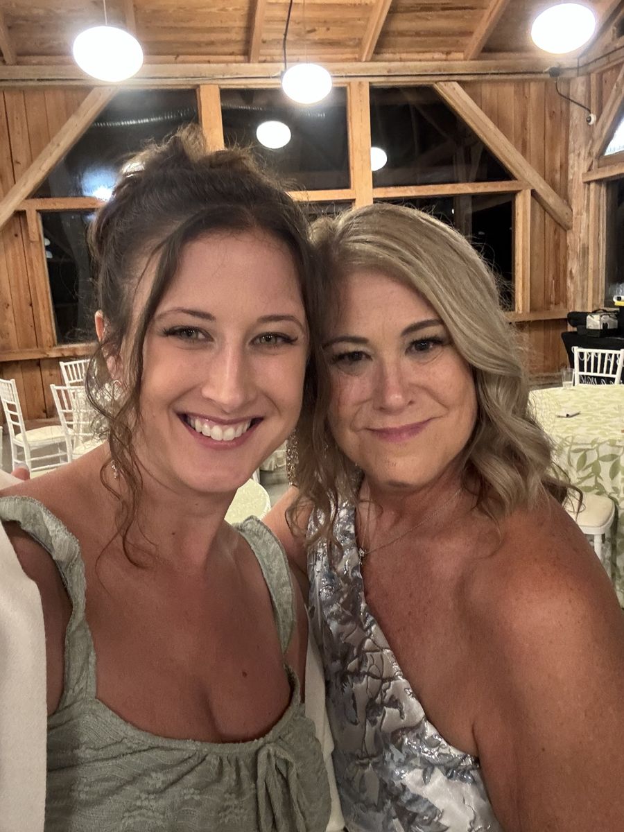Two clients at a wedding