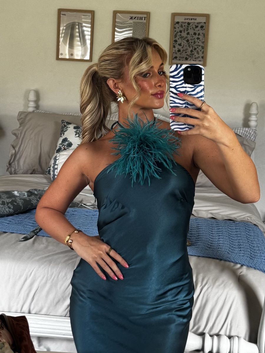 Client in a teal satin dress